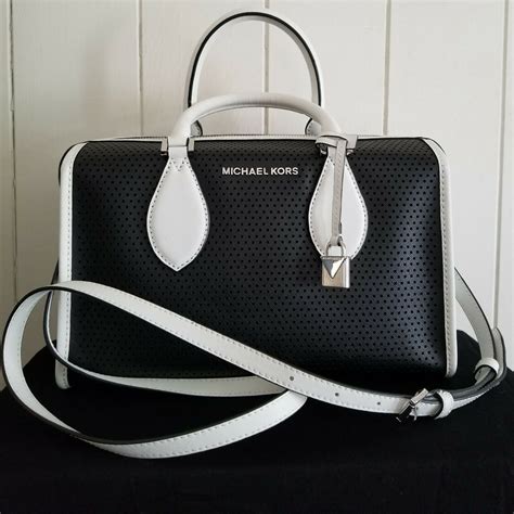 michael kors hard travel bag black and white|Michael Kors bag with airplanes.